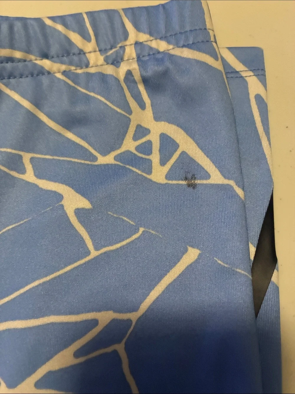 Nike Kids Light Blue & White Graphic Leggings with Black Swoosh